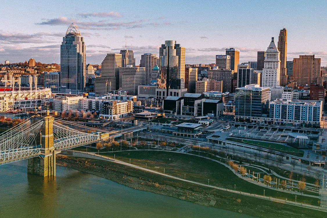 Aerial view of the Cincinnati skyline and riverfront at dusk