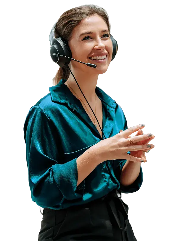 A CDB support representative wearing a headset, smiling while assisting a member