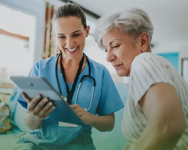 A care provider assisting a patient