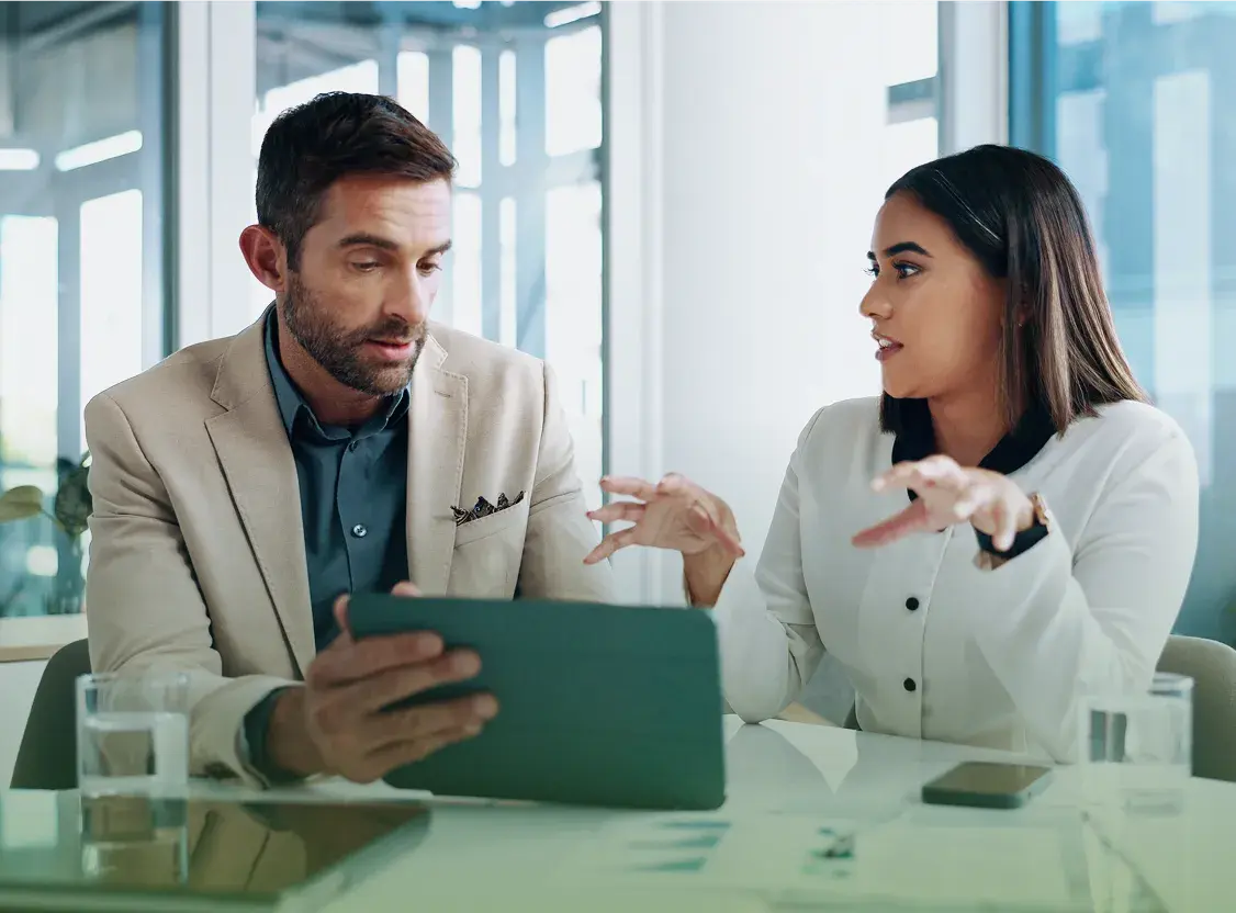A broker and an employer reviewing healthcare plan results together